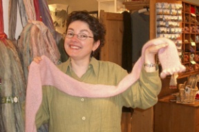 Kit Hutchin and the scarf she designed to help fight cancer.