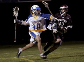 Spartan Willy Delius tries to keep his distance from Mercer Island’s Adam Brazg at Friday’s game at BHS.