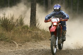 Jay Sherman races around the trail in Tahuya State Forest near Belfair. The Bainbridge resident is training to compete in the Tecate Score Baja 1000 to raise money for the National Breast Cancer Foundation in honor of his mother