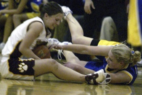 Allie Picha fights for a loose ball during Metro League play.