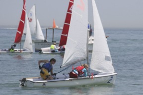 Adrian Mason and Haley Lane race downwind against Newport Harbor High School at the Team Race Championships.