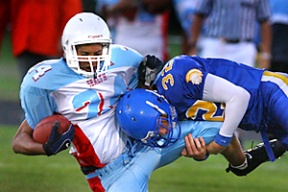 Bainbridge defensive back Mike Walsh makes the tackle on Chief Sealth wide receiver Gregory Wilson Friday night. The Spartans defeated the Seahawks 61-6.