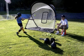 Bainbridge All-Star Faith Campbell practices her swing with coach Jay Kinney Wednesday at Strawberry Hill Park. The tournament starts today at noon at the park.