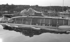The once-proud “Dock Holiday” met a watery fate.