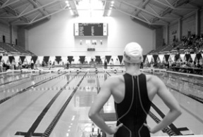 Emily Silver sizes up the pool before the 2003 state championships at the King County Aquatic Center. Silver and her older sister Helen have gone on to star with the prestigious Cal-Berkeley program.