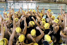 Bainbridge swimmers get themselves pumped up before their meet against Holy Names Oct. 24. The Spartans took third place at the 3A Sea-King District 2 meet Friday night at the Hec Ed pool at the University of Washington.