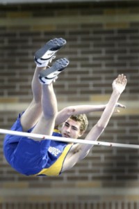 Senior Chris Darling clears the bar on his third attempt in the pole vault. He finished third in the pole vault with a mark of 8-6.