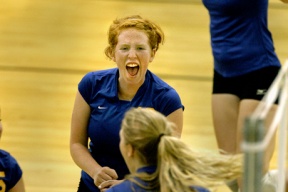 Hillary Grant celebrates a point with her teammates in early season play. She scored the game winning point against Seattle Prep Saturday.