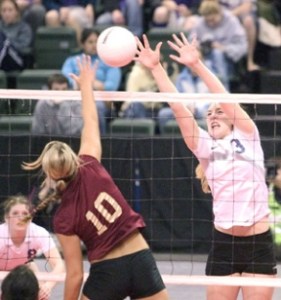 Spartan junior Marijke Schwarz-Smith jumps to block a shot by White River. BHS ultimately fell to White River in the state tourney.