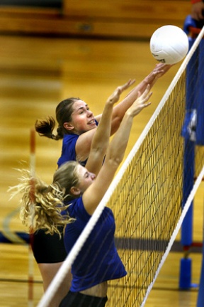 Hannah Stuart and Marijke Schwarz Smith go for the block during Bainbridge’s game against Bishop Blanchet Sept. 27. Bainbridge has won three straight.