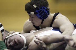 Spartan wrestler Brian Robert subdues an opponent during Metro League play recently. At last weekend’s regional tournament