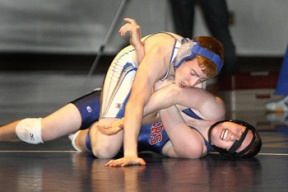 Bainbridge’s Brian Robert (on top) works for the pin against Nathan Hale’s Josh Arndt. Robert won the match by a 11-6 decision. The Spartans defeated the Raiders 48-20 Thursday night.