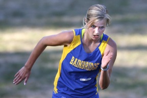 Callie McKenize hustles up the hill at Battle Point Park Wednesday. The senior finished a close second to teammate Emily Farrar with a time of 19:50 at the Metro League cross country meet.
