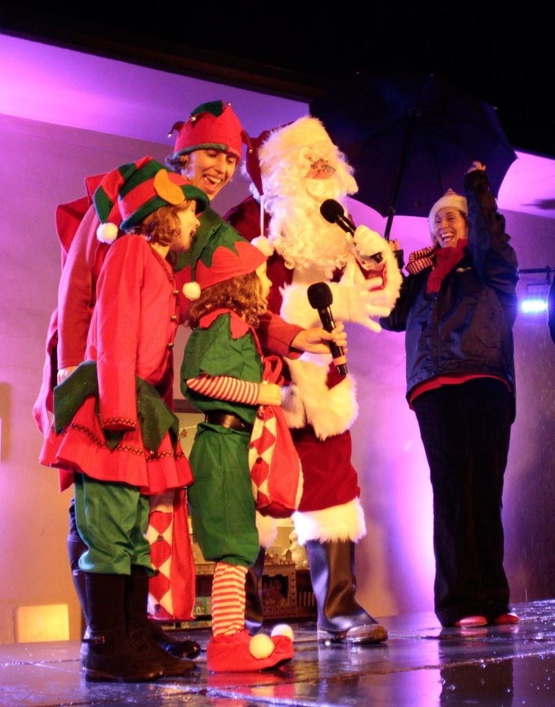 PHOTO GALLERY | A season’s soggy start: Rain did nothing to dampen holiday tree lighting tradition