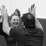Brian Kelly | Bainbridge Island Review                                Remi Rosencrans high fives Bainbridge Coach 
Bryan Garoutte after her vault routine.