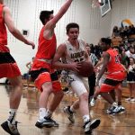 Luciano Marano | Bainbridge Island Review | Marianne Milander struggles for a rebound during last week&rsquo;s game against Eastside Catholic.