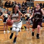 Luciano Marano | Bainbridge Island Review                                Bainbridge freshman Kendall Havill looks for an open teammate beneath Holly Names&rsquo; hoop.