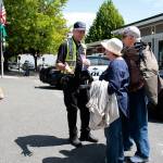 Luciano Marano | Bainbridge Island Review &mdash; Bainbridge Island Police Departmetn Parking Enforcement Officer Ken Lundgren assists some lost tourists. Lundgren was one of two key speakers at the last Citizen&rsquo;s Police Academy class.