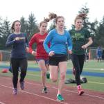 Luciano Marano | Bainbridge Island Review &mdash; Several members of the Bainbridge High School track and field team work through a practice session earlier this week.