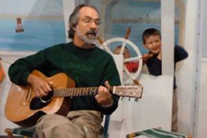 Kids have sing-along with David Webb at Tuesday Tunes