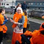 Members of Team Dragon Fly/Forest Ridge danced to entertain others and to try and stay warm on a cold, gusty morning. Center is Amira Haji. (Terryl Asla/Kitsap News Group)