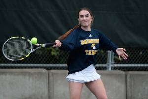 Spartans boys beat Prep in varisty tennis, girls come up short
