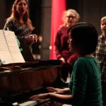 Luciano Marano | Bainbridge Island Review - Aimee Hong, in her Bainbridge Performing Arts debut as music director, leads a vocal warm up prior to a recent &ldquo;Big Fish&rdquo; practice session.