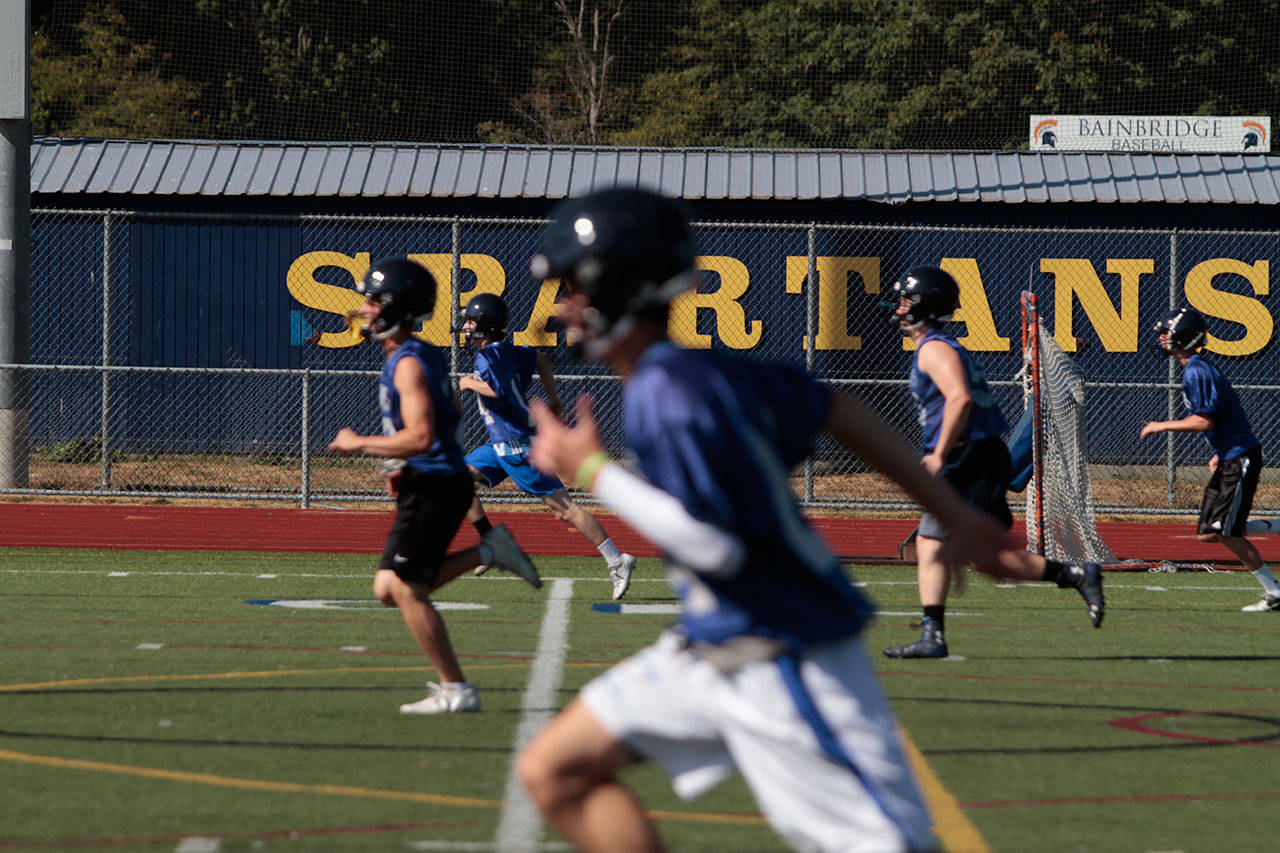 Luciano Marano | Bainbridge Island Review - The Bainbridge High School varsity football team works through sprint drills during a recent practice session.