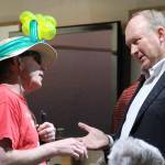 Jerry Brader Jr., a Bainbridge resident who performs as Majick The Clown, shares his concerns about a proposed ban on the sale and use of balloons with Councilman Mike Scott during a break in Tuesday&rsquo;s council meeting. (Brian Kelly | Bainbridge Island Review)