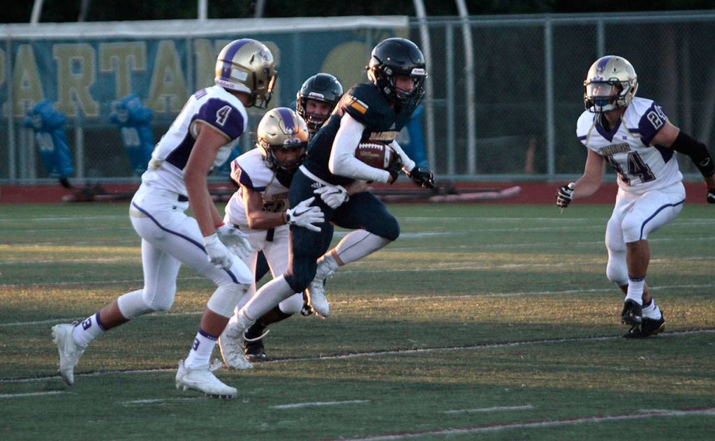 Spartans stumble in first football outing | Photo gallery