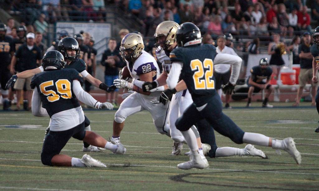 Spartans stumble in first football outing | Photo gallery