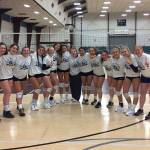 The Bainbridge Spartans volleyball team gathers for a team picture after winning the Kitsap Classic Volleyball Tournament. (Photo courtesy of Dominique Atherley)