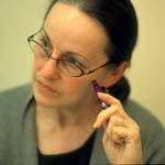 Nellie Thomas listens intently as her doctors explain her treatment options.