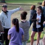 Spartan Head Coach Ian Havill chats with some of the younger players from both the Bainbridge and Garfield teams at the start of the first hole. (Luciano Marano | Bainbridge Island Review)