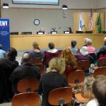 Luciano Marano | Bainbridge Island Review - A crowd gathers to put questions to Bainbridge Island School Board candidates Mike Spence (at left, unopposed, Director District 2), and Sheila Jakubik (center) and Christina Wakefield (right), battling each other for the District 5 position.