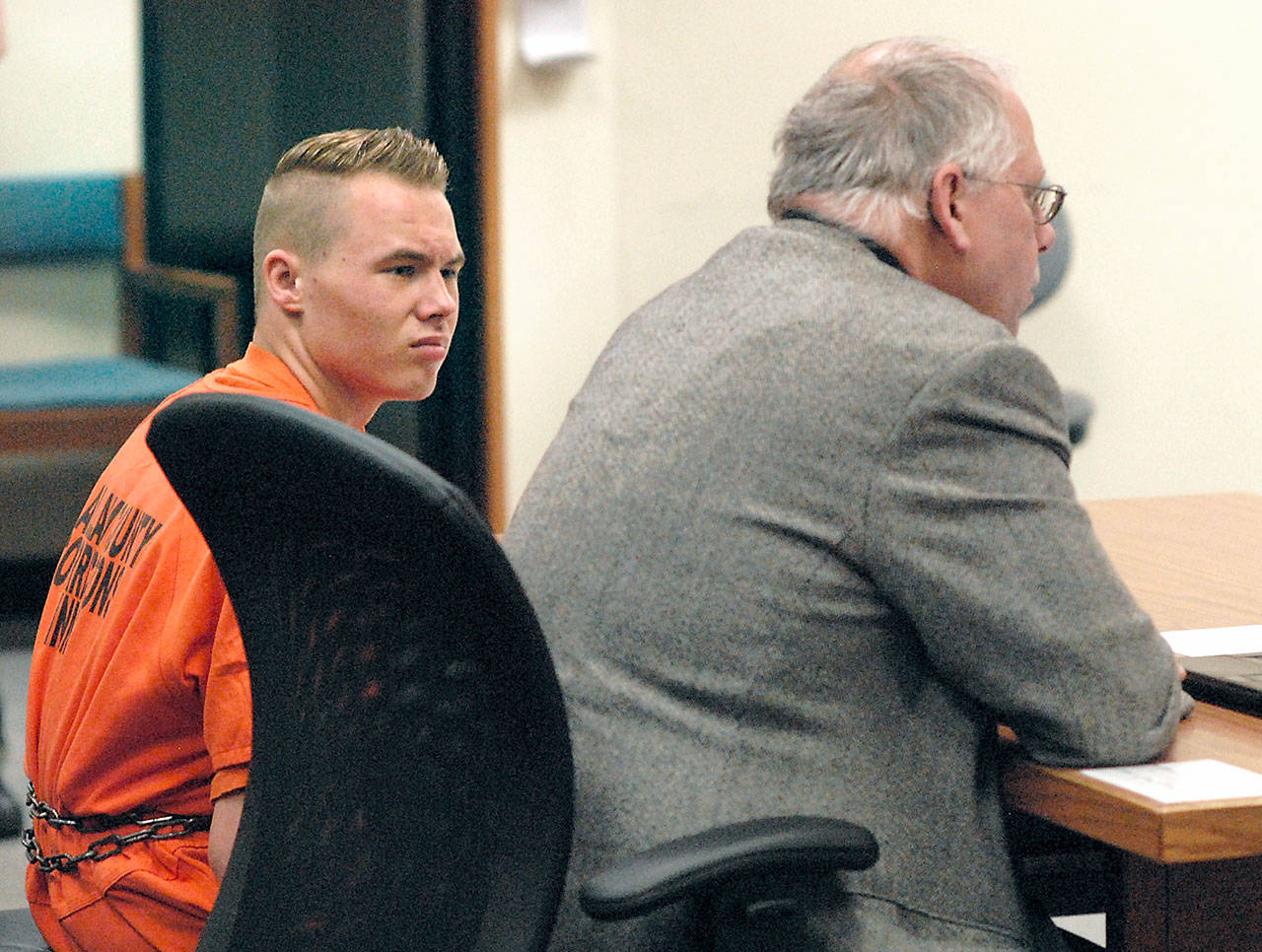 Benjamin Bonner looks at defense attorney Harry Gasnick during Bonners first appearance in Clallam County Superior Court in May. (Keith Thorpe/Peninsula Daily News)