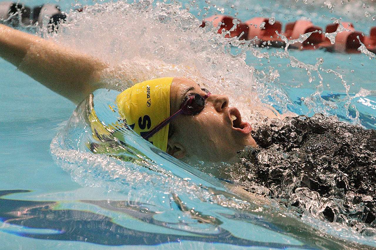 The Spartans Moorea Eldon-Everts swims in the 100-yard backstroke at the state swimming championships in Federal Way.                                (Brian Kelly | Bainbridge Island Review)