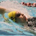 The Spartans Moorea Eldon-Everts swims in the 100-yard backstroke at the state swimming championships in Federal Way.                                (Brian Kelly | Bainbridge Island Review)
