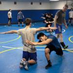 Luciano Marano | Bainbridge Island Review - Spartan Head Coach Dan Pippinger observes a recent varsity wrestling team practice session.