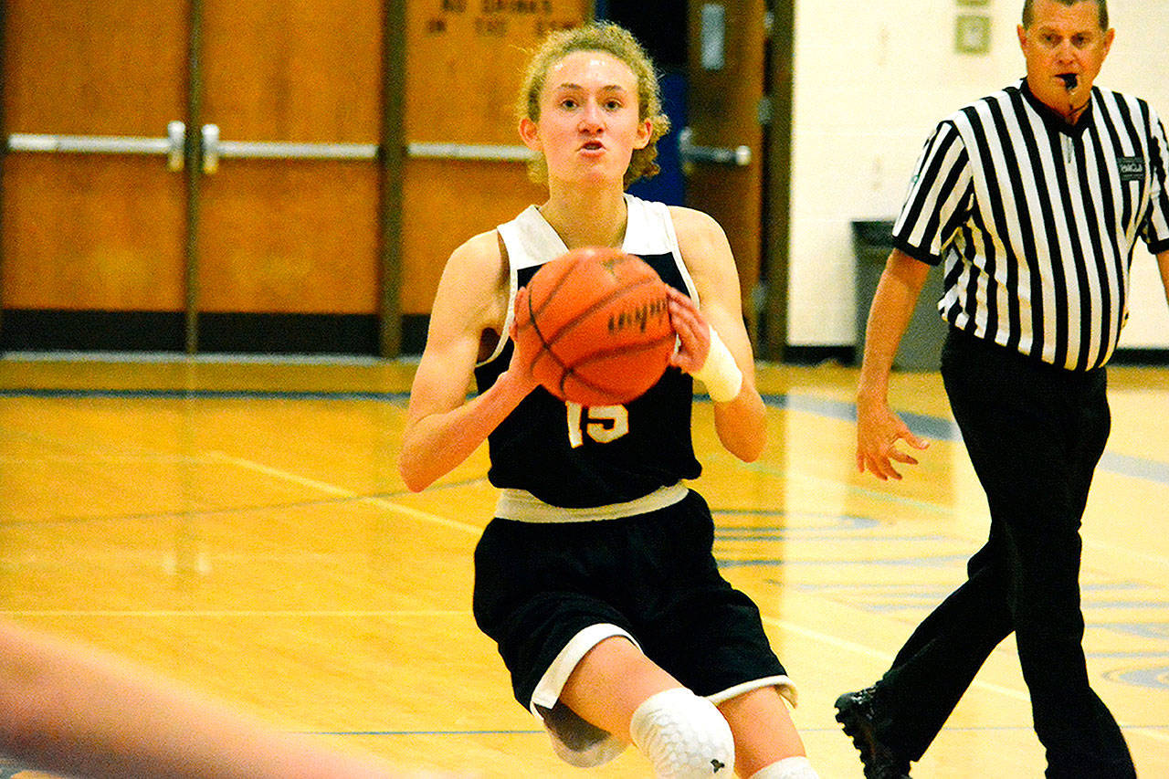 Mark Krulish/Kitsap News Group | Bainbridge sophomore Olivia Wikstrom pulls up for a jumper. Wikstrom scored a game-high 21 points in her teams victory Monday.