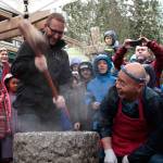 A visitor to last years event takes a turn at pounding rice into mochi. (Luciano Marano | The Bainbridge Review)
