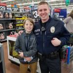 Bainbridge Police Officer Joshua Buonvino pauses for a photo with Jacob Jacobson, age 13. (Photo courtesy of the Bainbridge Island Police Department)