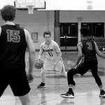 Luciano Marano | Bainbridge Island Review - Spartan junior Jackson Taylor looks for a path around some ravenous Lions in Tuesday nights home game against Lakeside.