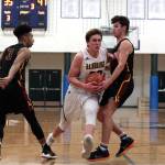 Luciano Marano | Bainbridge Island Review - Senior Spartan, team cocaptain Charlie Hoberg drives to the net during Tuesdays game against Lakeside.