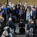 Odysessy students sing the African lullaby The Lion Sleeps Tonight at the celebration of life service for Baden and Troy Biddle. (Brian Kelly | Bainbridge Island Review)