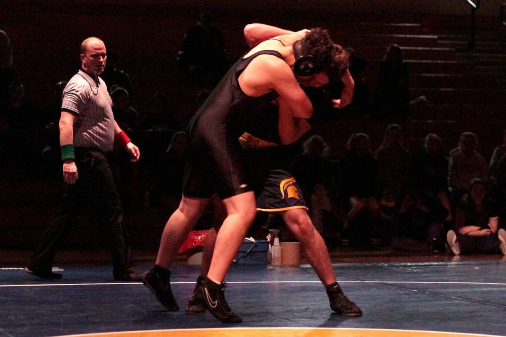 Spartans win some, lose some in year’s first home wrestling meet | Photo gallery