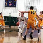 Luciano Marano | Bainbridge Island Review - Bainbridge High junior Jackson Taylor drives toward the hoop in last weeks game against St. Francis de Sales College, of Mount Barker, Australia.