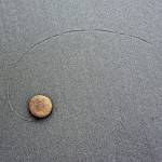 The photo 1Rock by Bainbridge Island photographer Dinah Satterwhite has been chosen for inclusion in the 2018 Washington State CVG Art Show. The photograph is a very simple, almost zen-like image, with every single grain of sand in focus, and a beautiful swirl drawn in the sand ending with a single flat rock, Satterwhite said. She made the image while on vacation at Kalaloch Beach, where she found herself on the beach and happened to look down at her feet and notice a perfect swirl in the sand created by a rock guided by the shallow water. (Photo courtesy of Dinah Satterwhite)