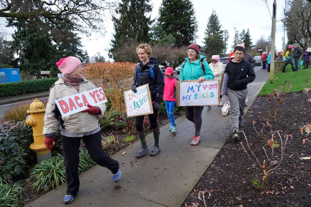 High hopes, busy feet: Bainbridge heads off to the second Women’s March | Photo gallery