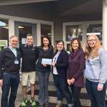 Photo courtesy of Helpline House | Outgoing Helpline House interim executive director Matt Eldridge (left), Island Fitness Owners Michael and Alexa Rosenthal, new Helpline House Executive Director Maria Metzler, and Island Fitness professional trainers and Turkey Trot organizers Brenda Prickett and Dominique Atherley pose for a photo with the check from last years Turkey Trot proceeds, which were donated to the island nonprofit.